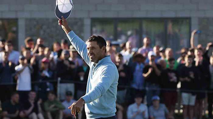 Charl Schwartzel waves to the crowd after winning the inaugural LIV Golf event at Centurion Golf Club outside London.